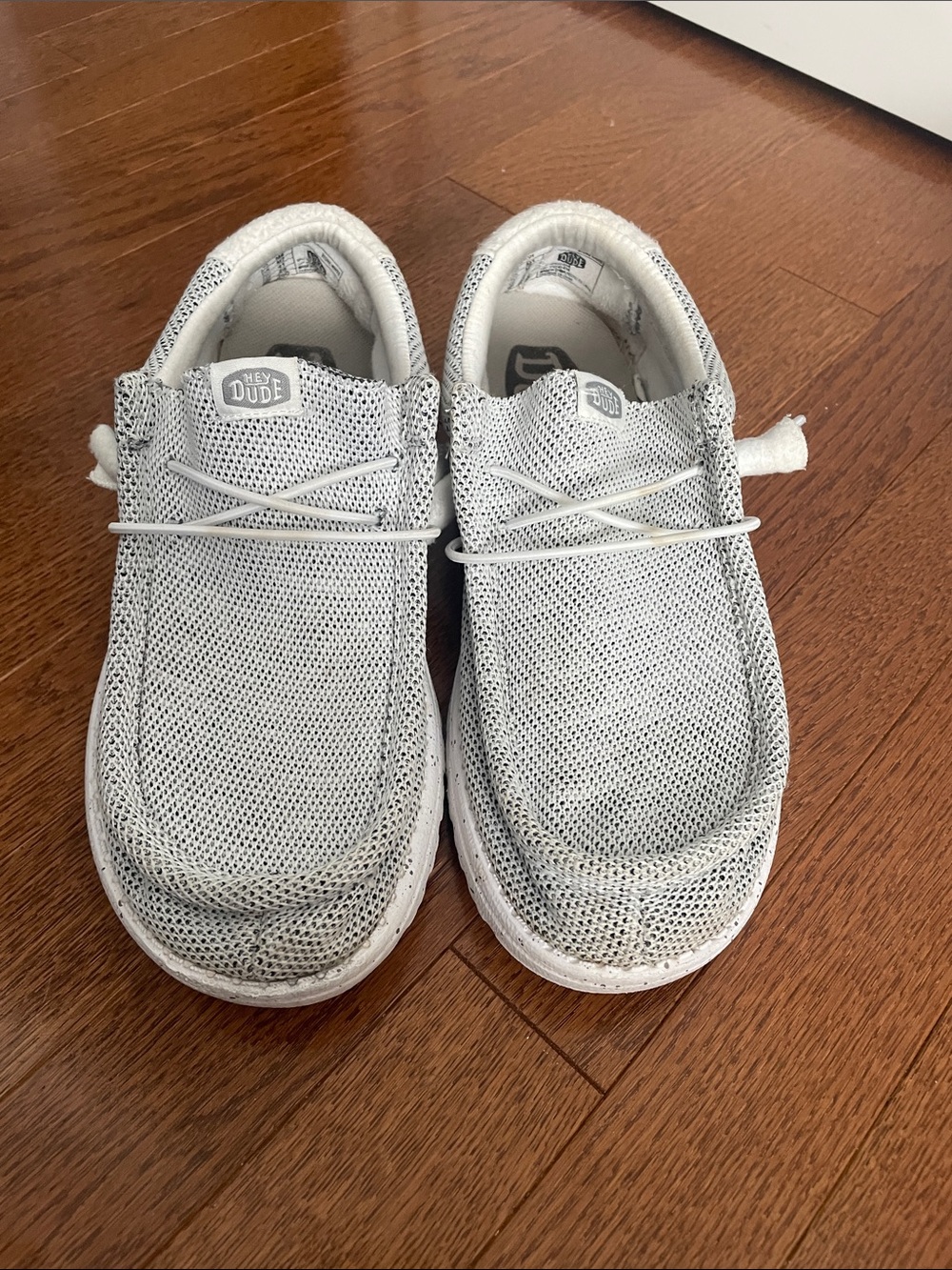 Hey Dude men’s Slip-On Sneakers in Light Gray and White